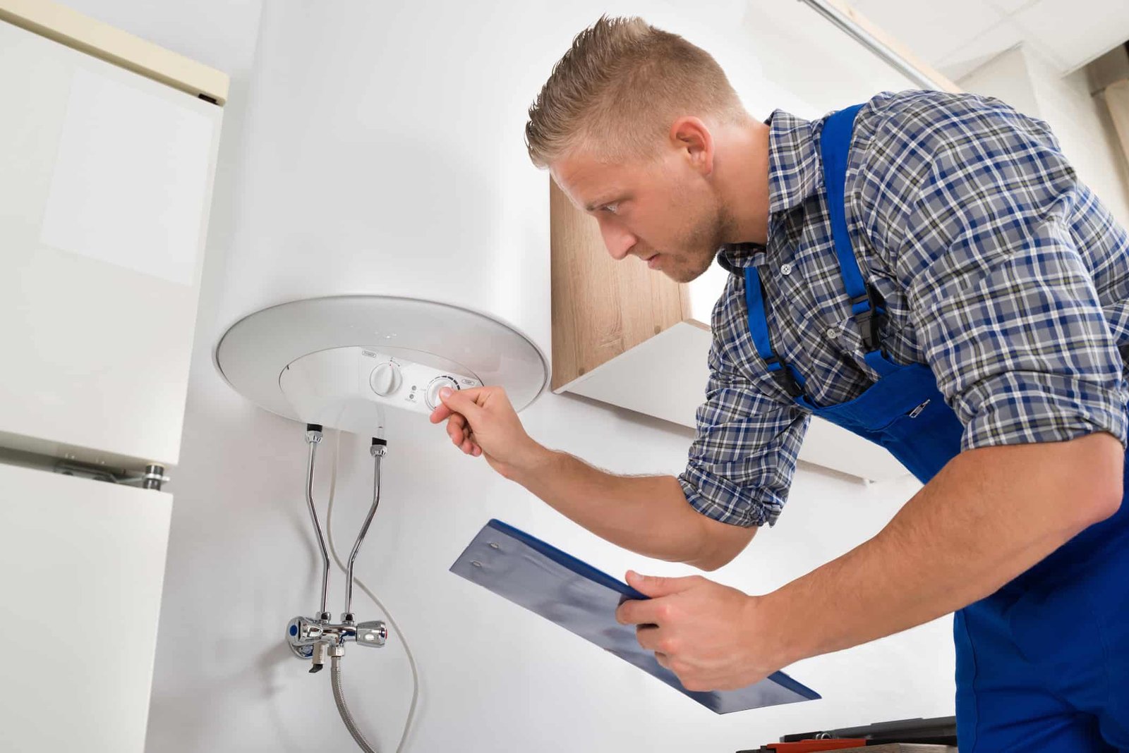 plumber repairing water heater