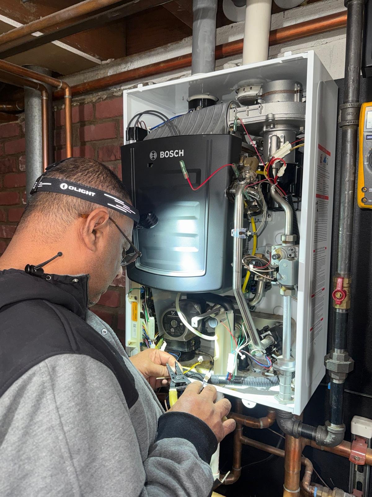 our technician is repairing the tankless water heater